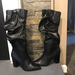 Black slouch knee boots.